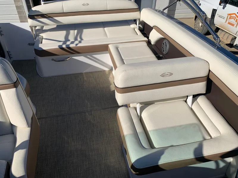 Slide: The Image of Luxurious seating on 2017 Marker One ML4 boat with beige and brown upholstery. - 14