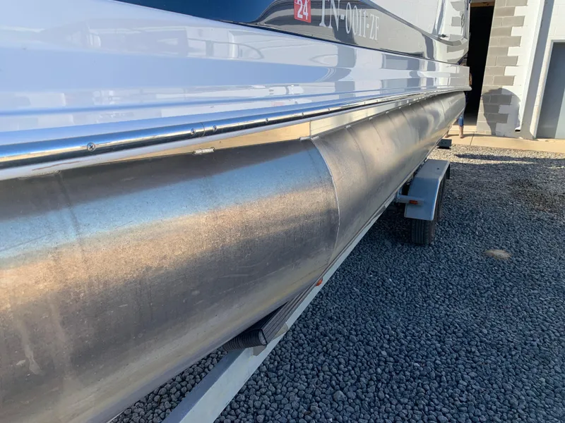 Slide: The Image of Marker One ML4 pontoon boat on trailer, side view, 2017 model. - 2