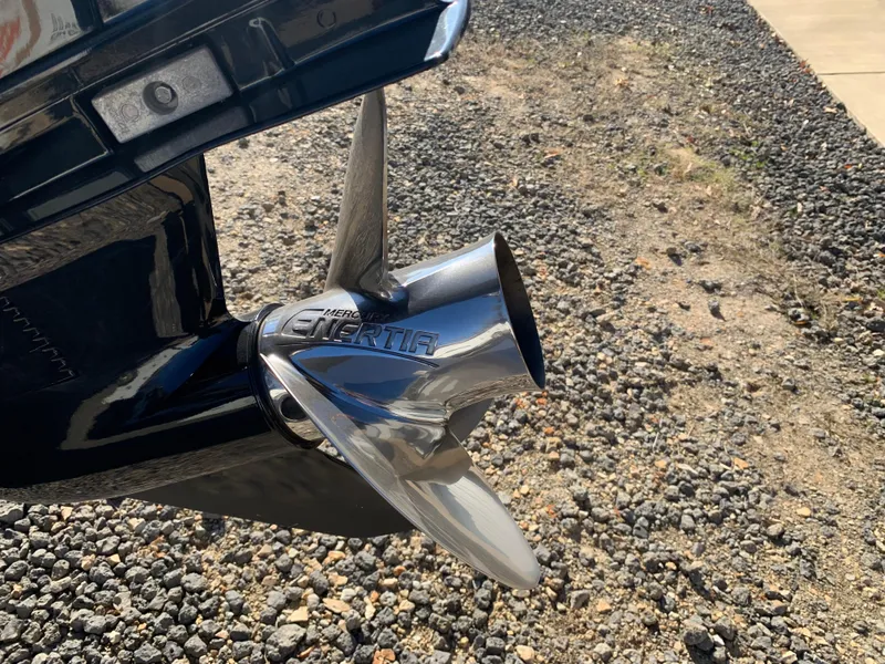 Slide: The Image of Close-up of a 2017 Marker One ML4 boat propeller on gravel surface. - 27