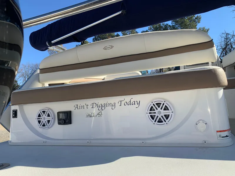 Slide: The Image of 2017 Marker One ML4 boat with custom seating and speakers, named "Ain't Digging Today." - 6