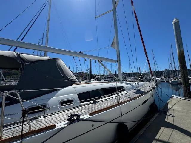 Slide: The Image of 2007 Beneteau 49 sailboat docked in a sunny marina. - 13