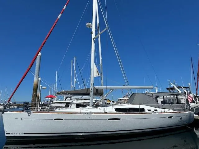Slide: The Image of 2007 Beneteau 49 sailboat docked in marina under clear blue sky. - 20