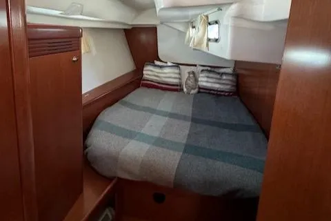 Slide: The Image of Cozy cabin interior of 2007 Beneteau 49 sailboat with comfortable bedding. - 22