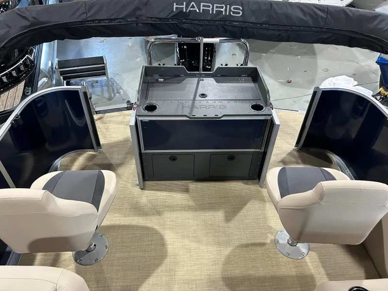 Slide: The Image of 2025 Harris Cruiser 210 FC interior with seating and storage compartments. - 10