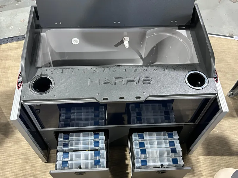 Slide: The Image of Harris Cruiser 210 FC 2025 boat console with storage drawers and sink. - 5