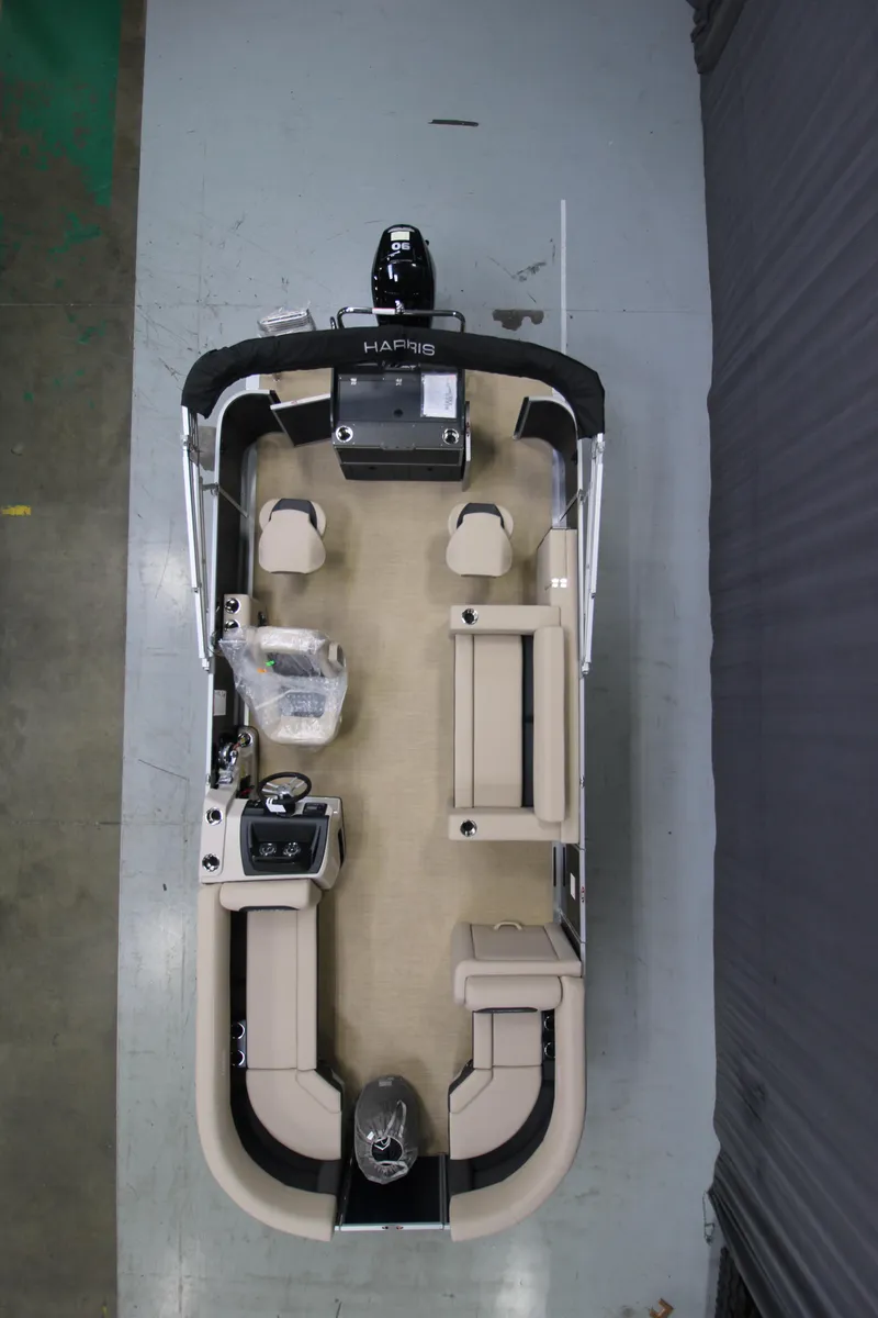 Slide: The Image of 2025 Harris Cruiser 210 FC pontoon boat, top view, beige interior, modern design. - 6