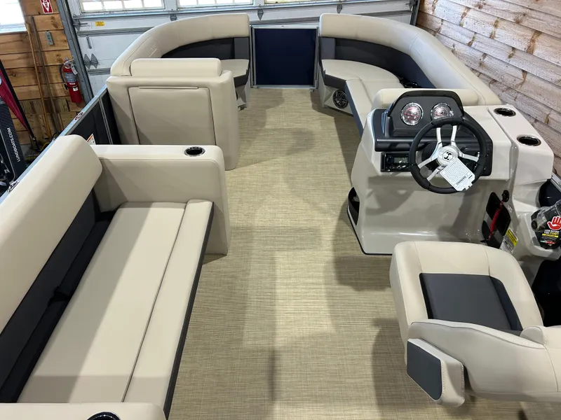 Slide: The Image of Interior of 2025 Harris Cruiser 210 FC pontoon boat with beige seating and modern helm. - 8