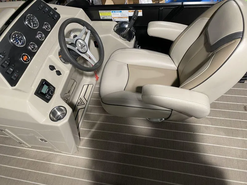 Slide: The Image of Viaggio Lago U L22U 2022 boat cockpit with steering wheel and captain's chair. - 10