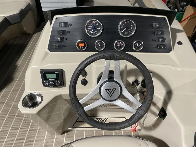Slide: The Image of Viaggio Lago U L22U 2022 boat dashboard with steering wheel and control panel. - 11