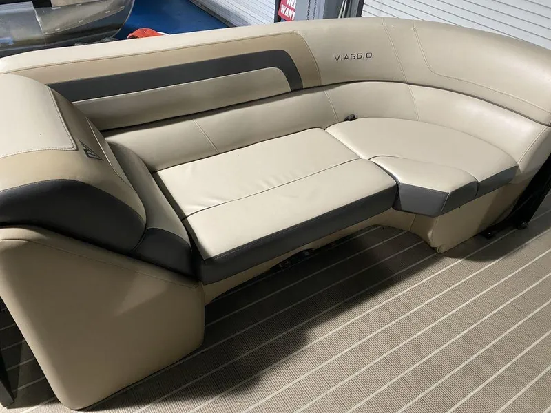 Slide: The Image of 2022 Viaggio Lago U L22U boat interior with beige and gray seating. - 13
