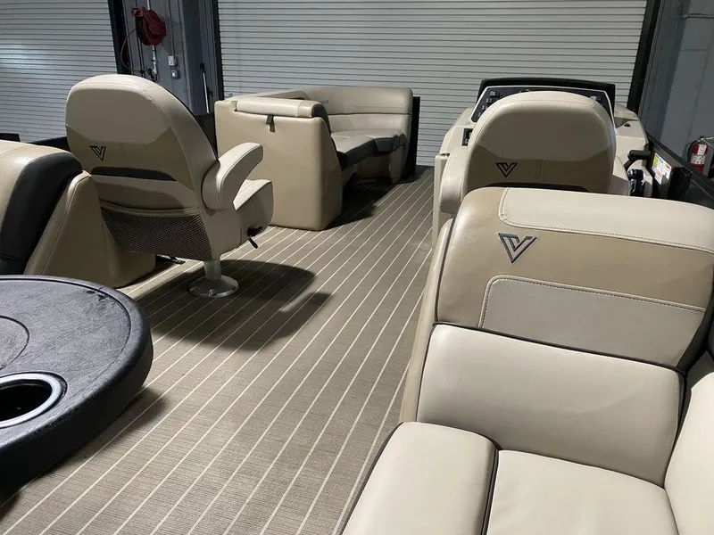 Slide: The Image of 2022 Viaggio Lago U L22U boat interior with beige seating and striped flooring. - 14