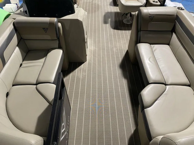 Slide: The Image of Viaggio Lago U L22U 2022 boat interior with beige leather seating and striped flooring. - 15