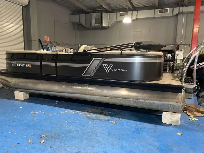 Slide: The Image of 2022 Viaggio Lago U L22U pontoon boat in indoor storage. - 3