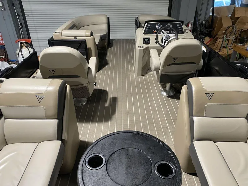 Slide: The Image of 2022 Viaggio Lago U L22U boat interior with beige seating and steering console. - 9