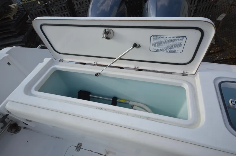 Slide: The Image of Open storage compartment on 2015 Sea Hunt Gamefish 27 boat. - 14
