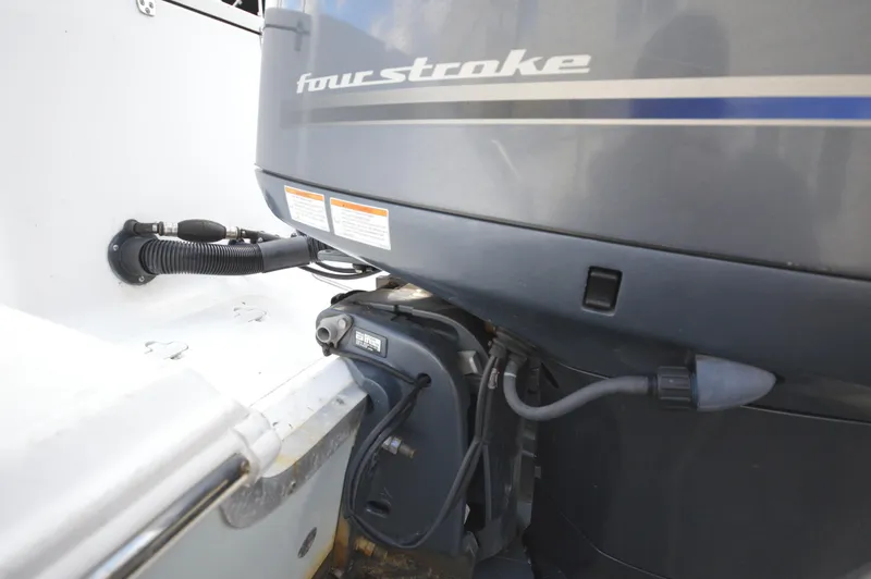 Slide: The Image of 2015 Sea Hunt Gamefish 27 boat with four-stroke engine detail. - 7