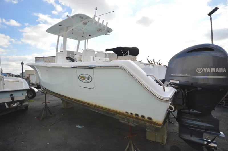 Slide: The Image of 2015 Sea Hunt Gamefish 27 boat with Yamaha outboard motor on dry dock. - 9
