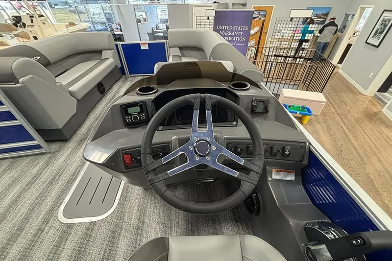 Slide: The Image of Interior view of 2025 Bennington S 21 Cruise boat with steering wheel and seating. - 12