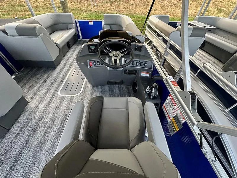 Slide: The Image of 2025 Bennington S 21 Cruise boat interior with modern seating and steering console. - 3