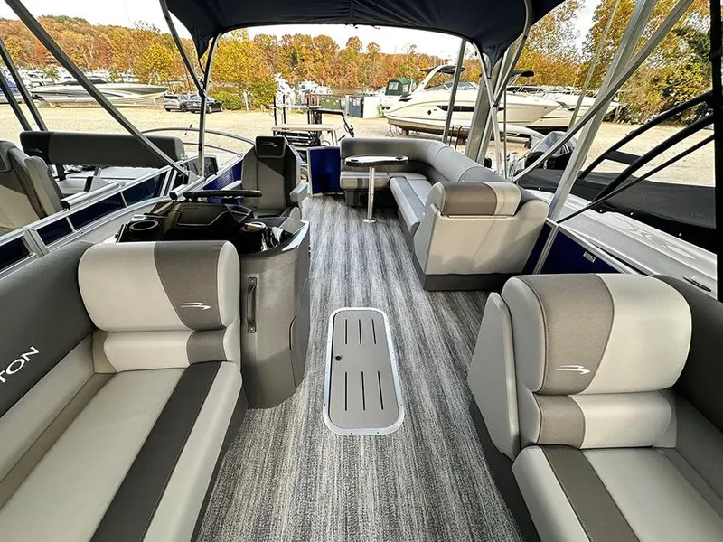 Slide: The Image of 2025 Bennington S 21 Cruise pontoon boat interior with gray seating and striped flooring. - 5