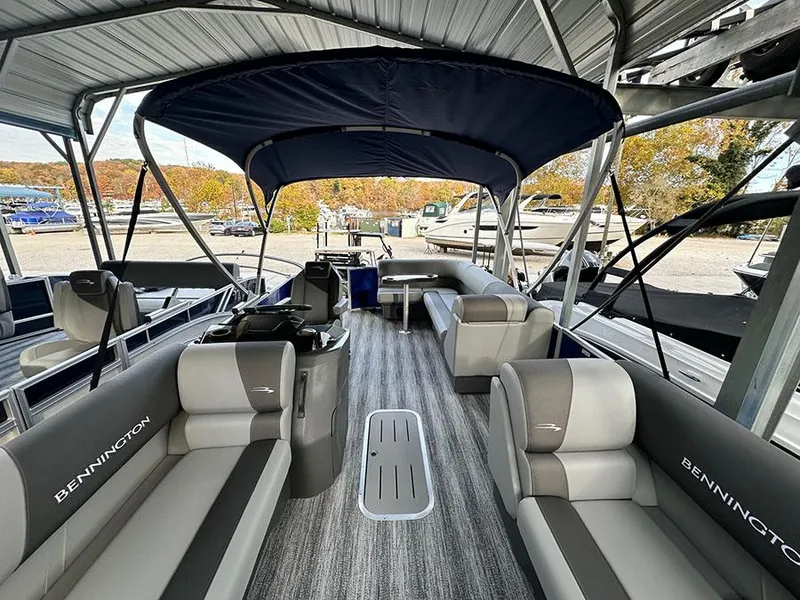 Slide: The Image of 2025 Bennington S 21 Cruise pontoon boat interior with seating and canopy. - 6