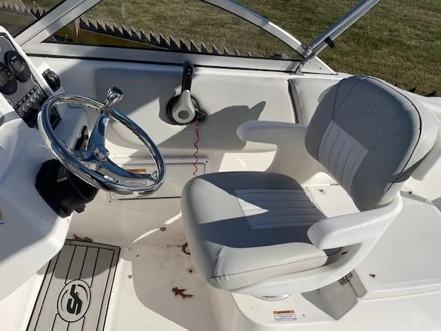Slide: The Image of 2022 Sea Fox 226 Traveler boat cockpit with steering wheel and captain's chair. - 14