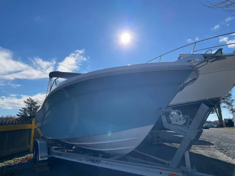 Slide: The Image of 2022 Sea Fox 226 Traveler boat on trailer under sunny sky. - 2