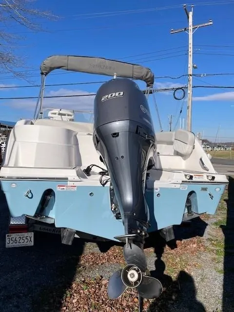 Slide: The Image of 2022 Sea Fox 226 Traveler boat with Yamaha 200 outboard motor, parked outdoors. - 5
