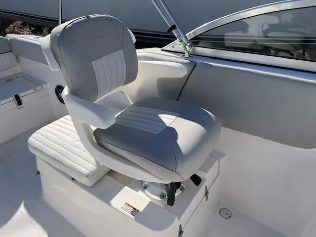 Slide: The Image of 2022 Sea Fox 226 Traveler boat seat, gray and white upholstery, modern design. - 8