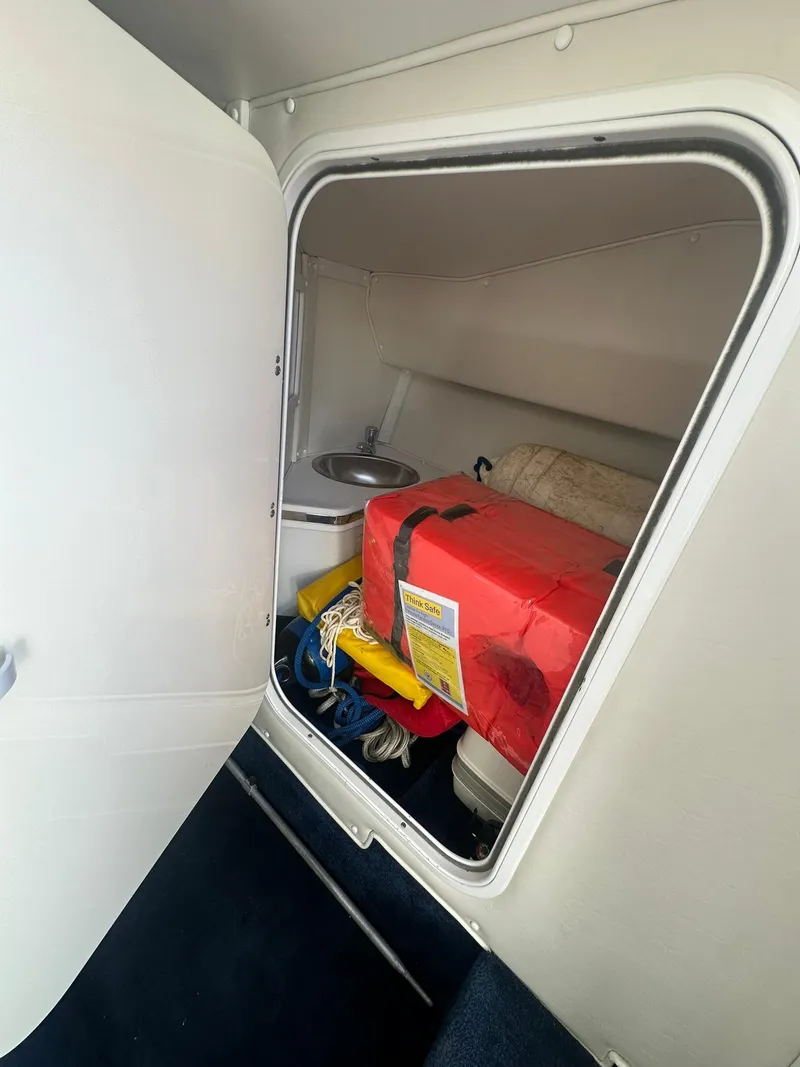 Slide: The Image of Interior cabin of 2003 Fountain 35 Executioner boat with storage and sink. - 13