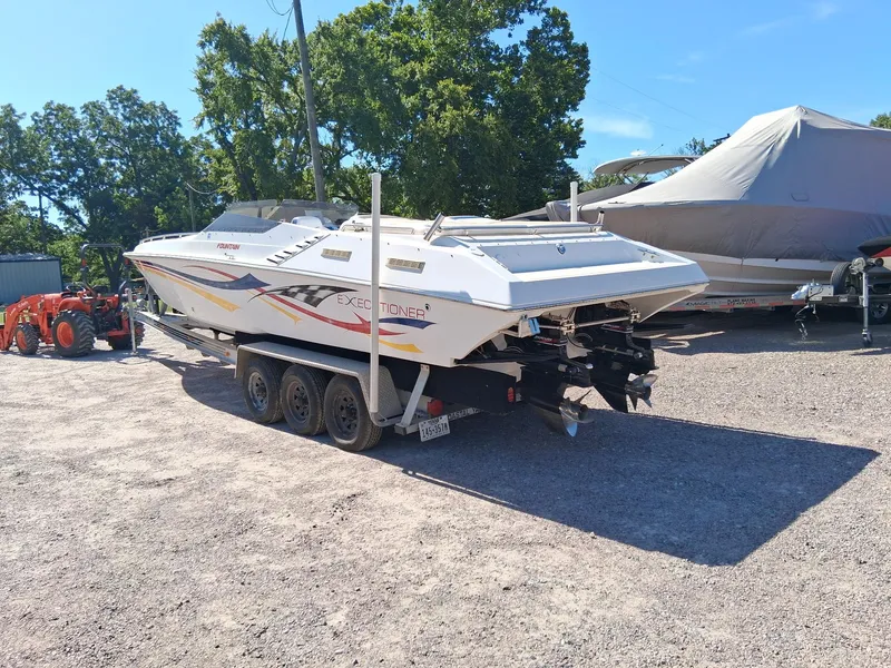Slide: The Image of 2003 Fountain 35 Executioner boat on trailer in outdoor storage area. - 17