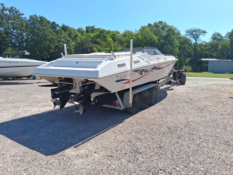 Slide: The Image of 2003 Fountain 35 Executioner boat on trailer, parked outdoors on gravel. - 18