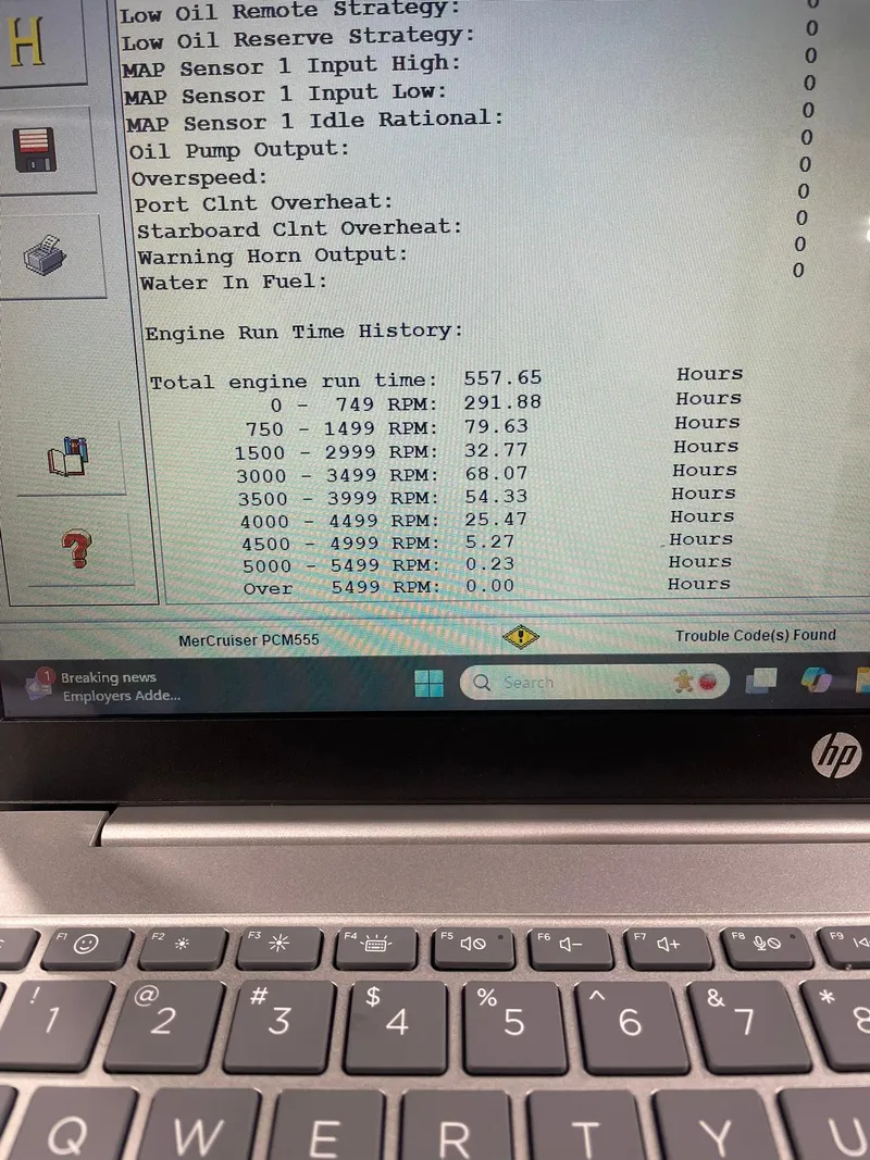Slide: The Image of Laptop displaying engine run time data for a 2003 Fountain 35 Executioner boat. - 21