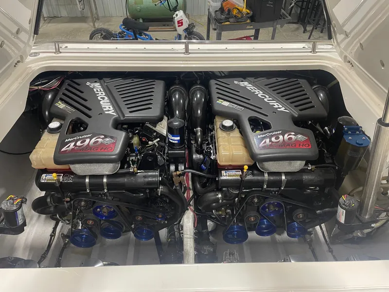 Slide: The Image of Twin Mercury engines in a 2003 Fountain 35 Executioner boat. - 5