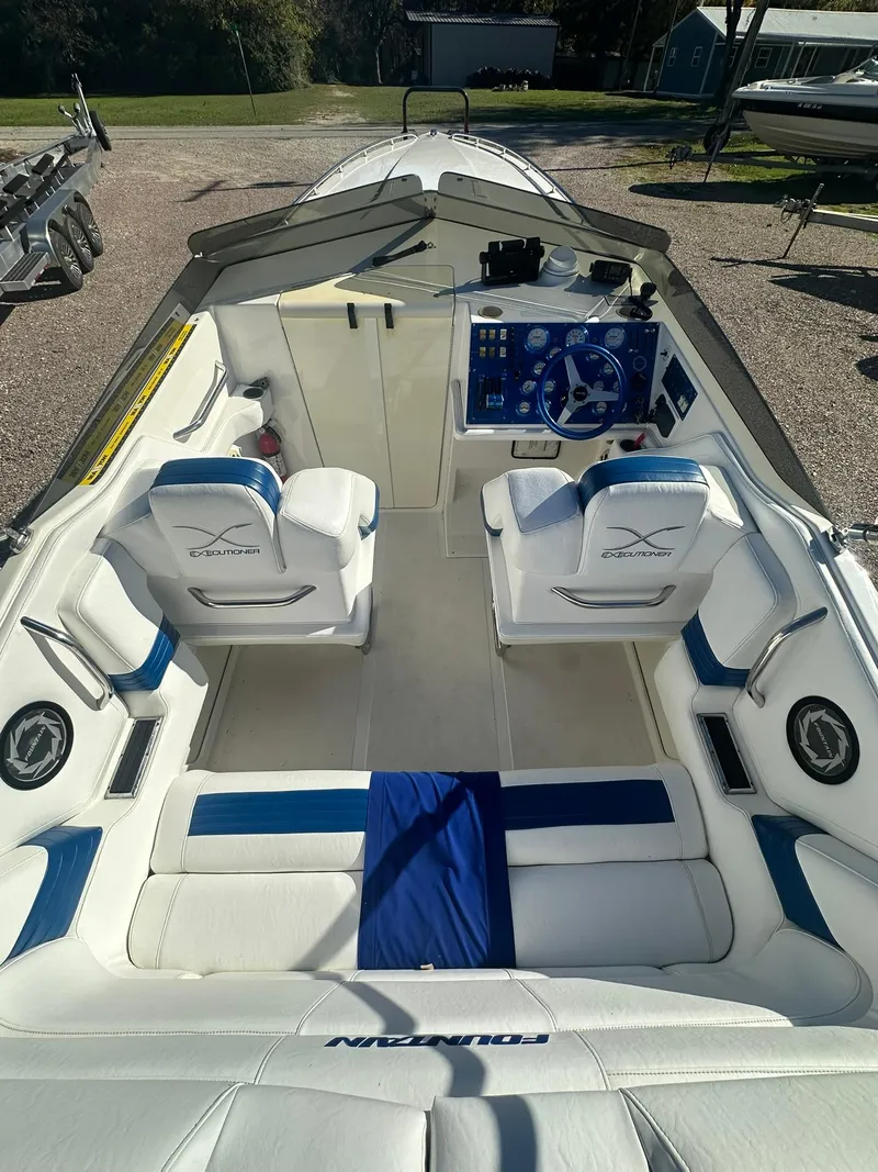 Slide: The Image of 2003 Fountain 35 Executioner boat interior with white and blue seating. - 6