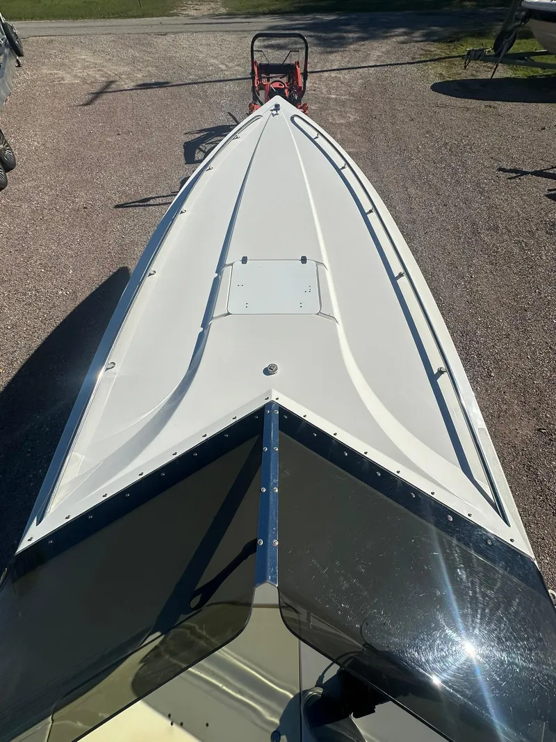 Slide: The Image of 2003 Fountain 35 Executioner boat, top view, parked on gravel. - 7