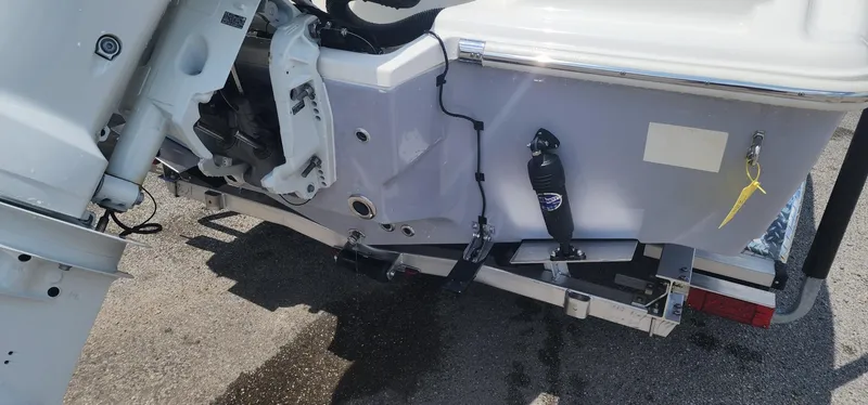 Slide: The Image of 2024 Key West 219fs boat transom with outboard motor and trailer. - 10