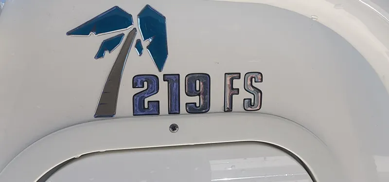 Slide: The Image of 2024 Key West 219fs boat logo with palm tree design. - 21
