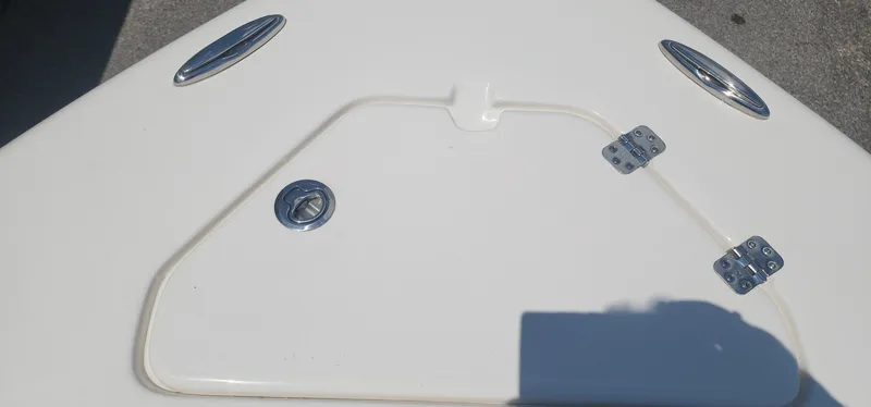 Slide: The Image of 2024 Key West 219fs boat deck with hatch and stainless steel fittings. - 23