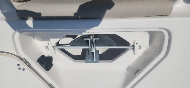 Slide: The Image of 2024 Key West 219fs boat anchor storage compartment with water droplets. - 24