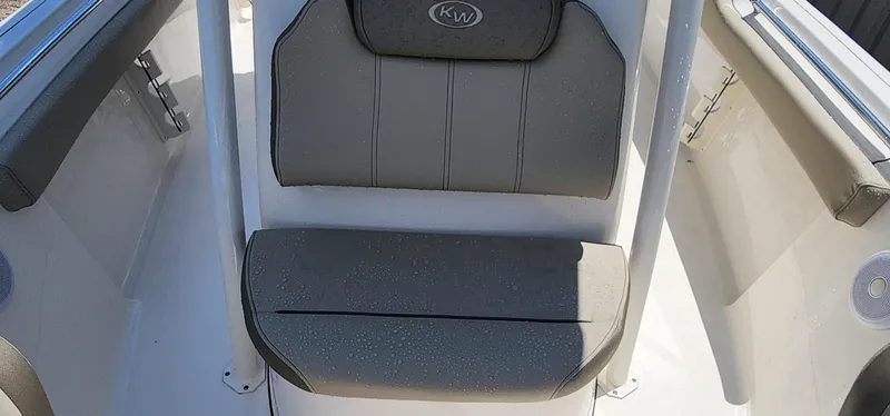 Slide: The Image of 2024 Key West 219fs boat seating area with gray cushions and sleek design. - 25