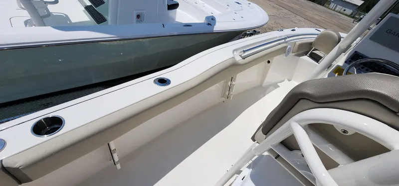 Slide: The Image of 2024 Key West 219fs boat interior with seating and rod holders. - 37