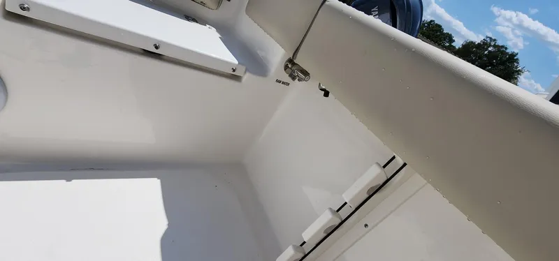 Slide: The Image of Interior view of 2024 Key West 219fs boat, showcasing sleek white design and storage features. - 38