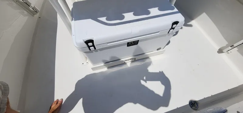 Slide: The Image of 2024 Key West 219fs boat deck with cooler and shadow. - 39