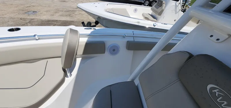 Slide: The Image of 2024 Key West 219fs boat interior with seating and speaker detail. - 41