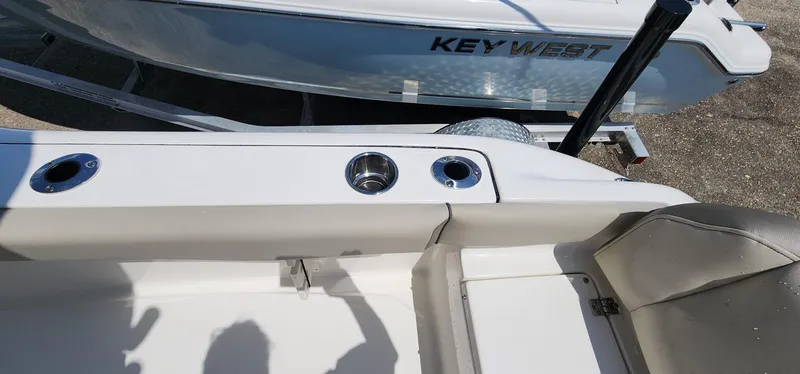 Slide: The Image of 2024 Key West 219fs boat interior with cup holders and seating. - 45
