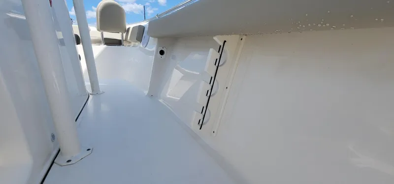 Slide: The Image of 2024 Key West 219fs boat interior, featuring sleek white design and seating. - 46