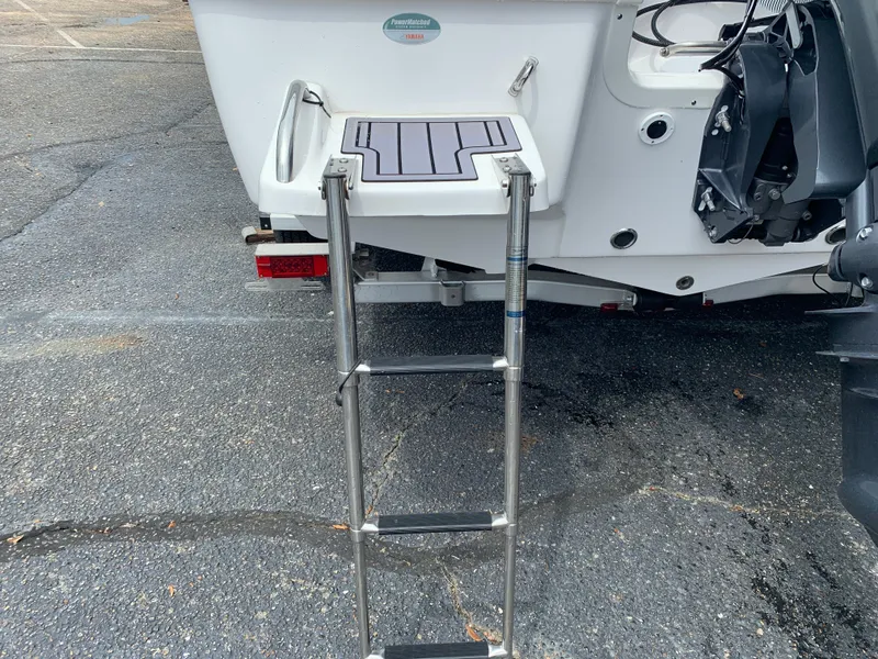 Slide: The Image of 2024 Tidewater 1910BM boat with rear ladder and swim platform. - 14