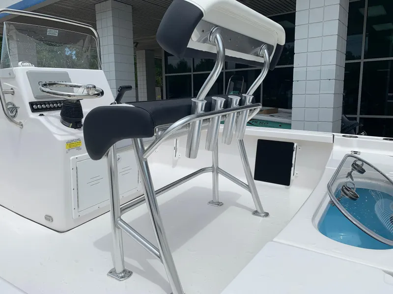 Slide: The Image of 2024 Tidewater 1910BM boat interior with steering console and rod holders. - 15
