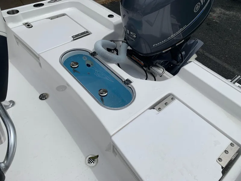 Slide: The Image of 2024 Tidewater 1910BM boat with Yamaha outboard motor, featuring a clean deck layout. - 18